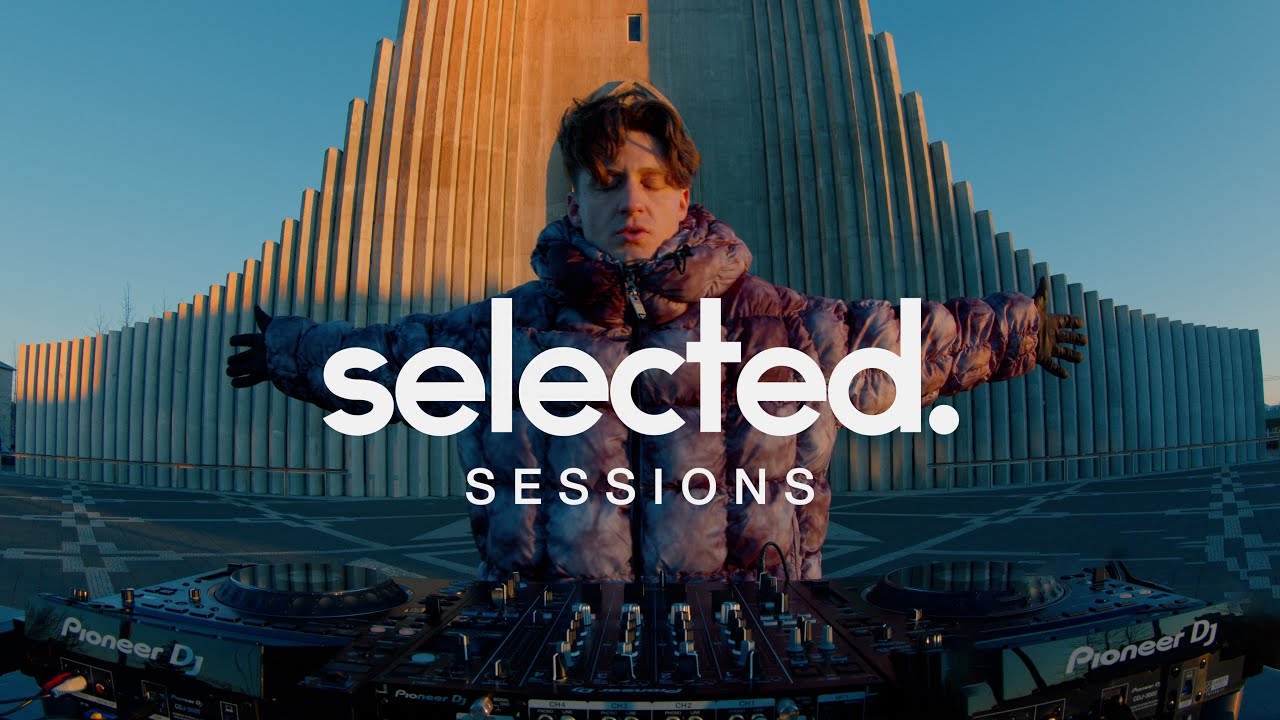 Aaron Hibell performing live with electronic and orchestral elements